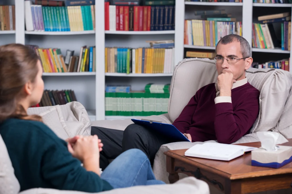 Therapist and client talking in a counseling office